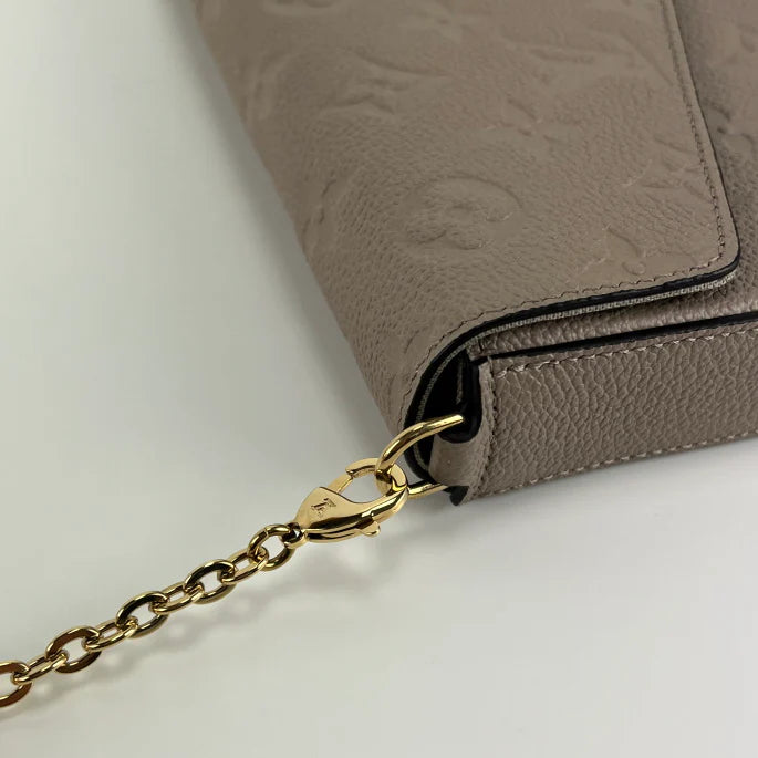 Bolsa Louis Vuitton empreinte pochette felicie in dune