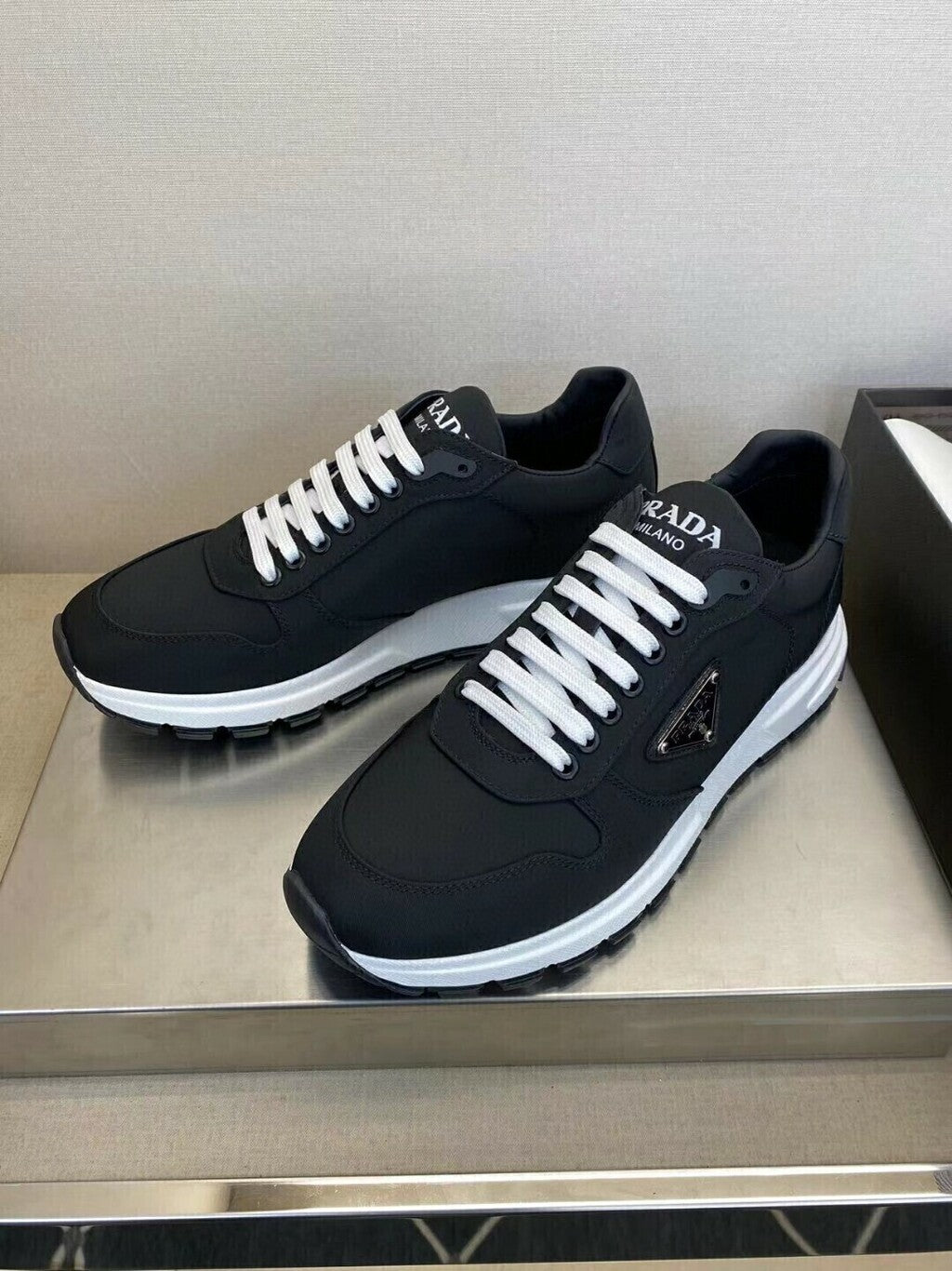 Prada PRAX 01 Sneakers Re Nylon Brushed Leather Black White prada-prax-01-sneakers-re-nylon-brushed-leather-black-white